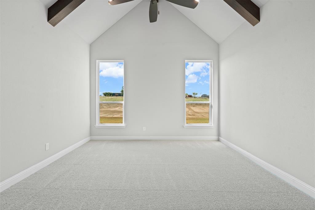 1005 Lilly Lane Weatherford, TX 76088 - Photo 19 of 34 an empty room with windows and fan