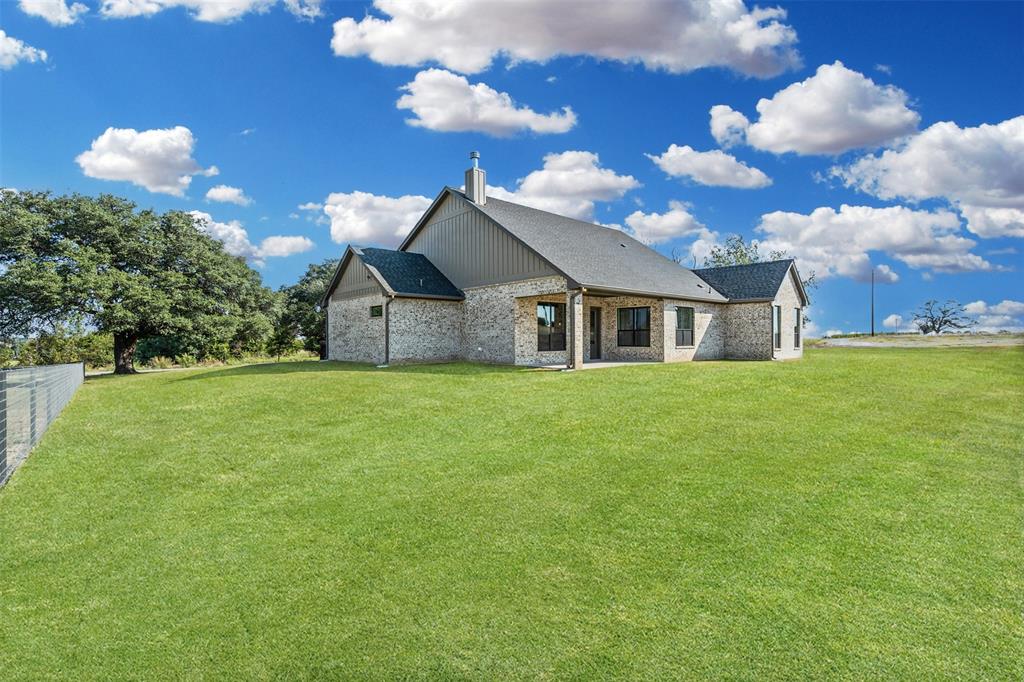 1005 Lilly Lane Weatherford, TX 76088 - Photo 31 of 34 a view of a house with a yard