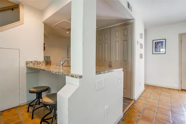 a en suite bathroom with a sink and a mirror