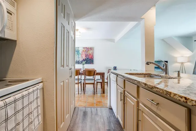 a kitchen with stove and cabinets