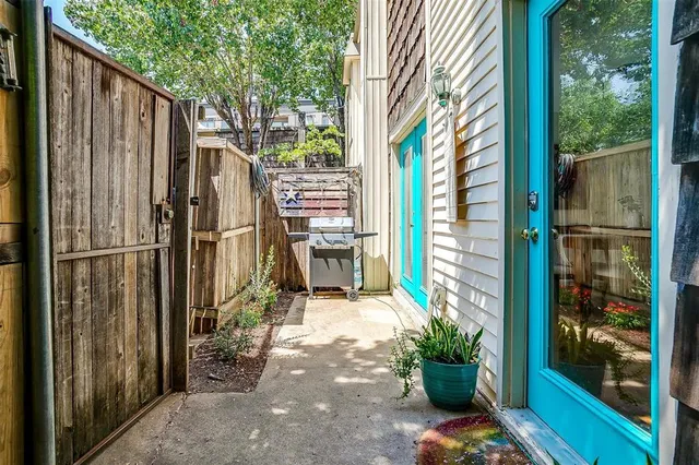 a front view of a house with outdoor seating