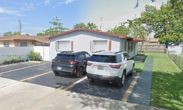 a car parked in front of a house