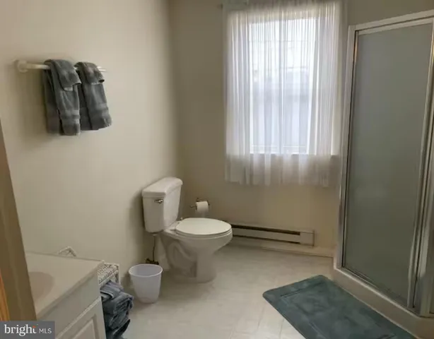 a view of living room with furniture and chandelier