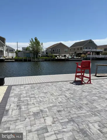 a front view of a house with trees