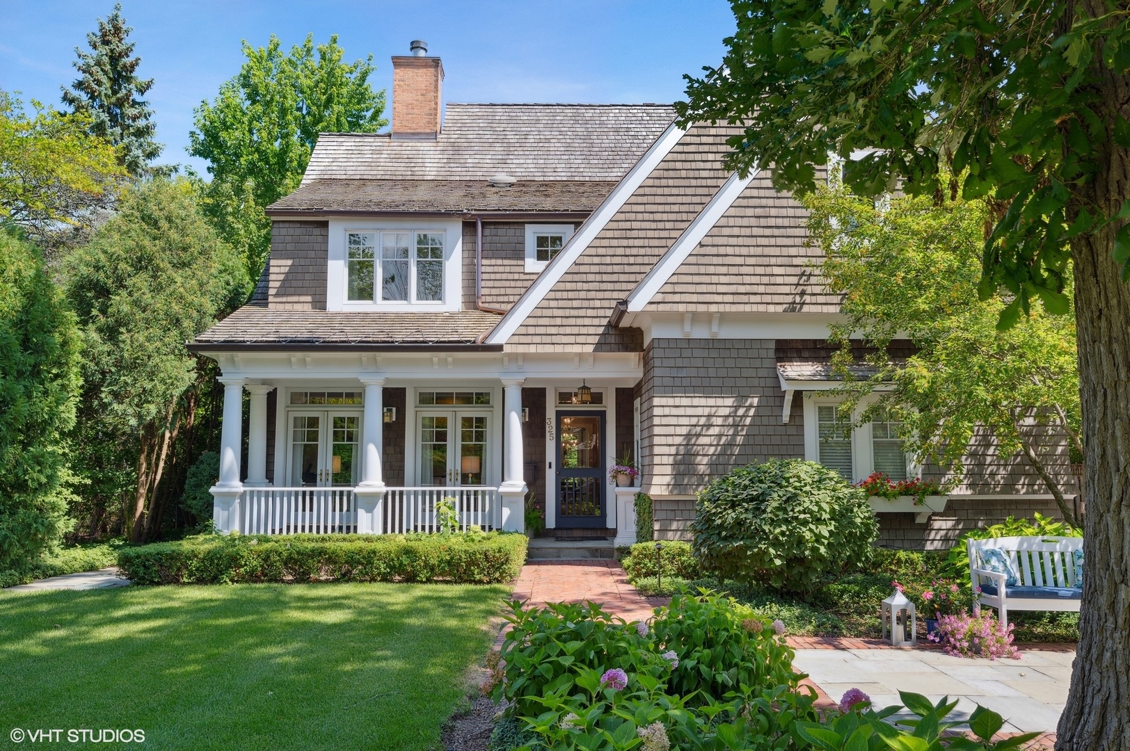 a view of a house with garden and yard