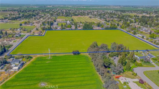 an aerial view of a residential houses with outdoor space