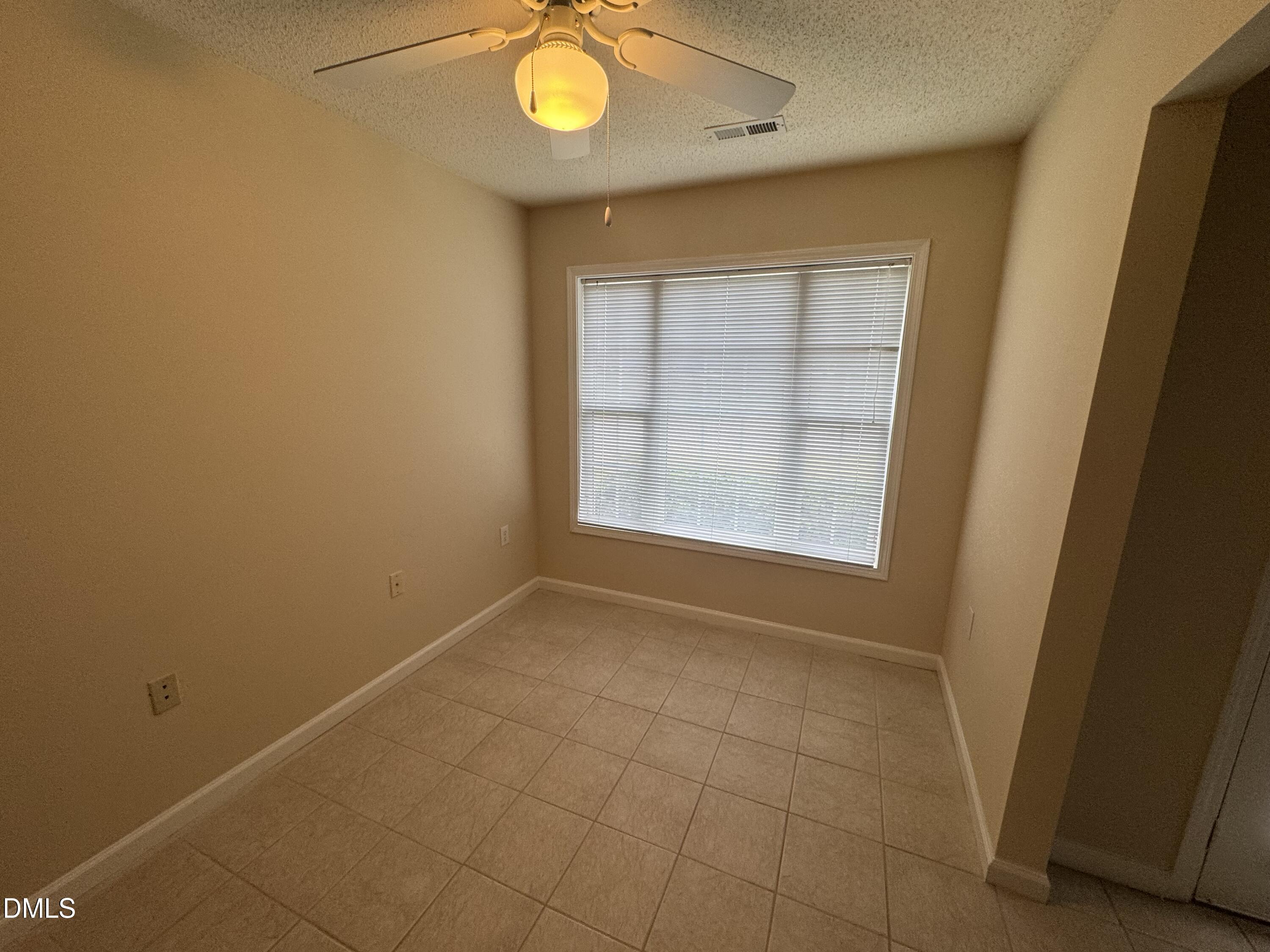 Undisclosed Address Raleigh, NC 27617 - Photo 5 of 22 an empty room with a window
