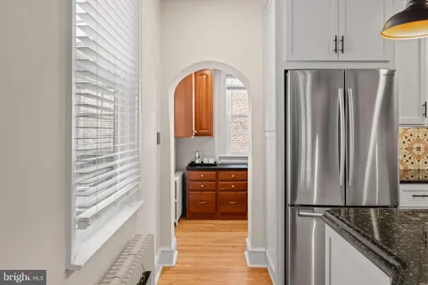 a view of a kitchen from the hallway