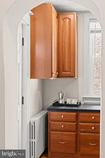 a kitchen with stainless steel appliances granite countertop a refrigerator and cabinets