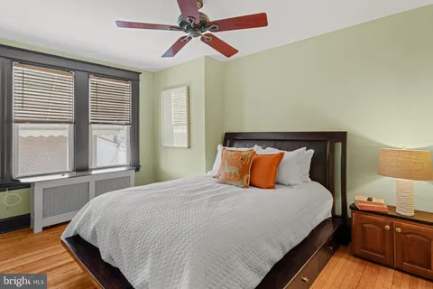 a bedroom with bed and window