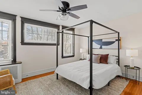 a bedroom with a bed and lamp