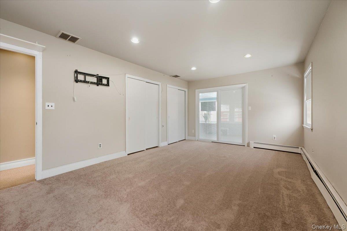 401 West Walnut Street, Unit UPPR Long Beach, NY 11561 - Photo 12 of 17 a view of an empty room