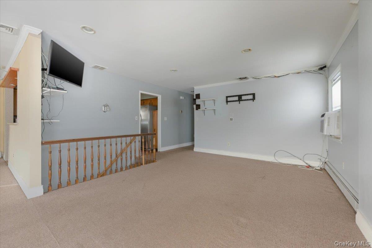 401 West Walnut Street, Unit UPPR Long Beach, NY 11561 - Photo 4 of 17 a view of a livingroom with an empty space