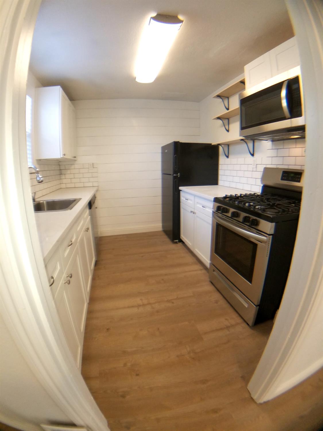 5121 Kenneth Avenue Carmichael, CA 95608 - Photo 7 of 38 a kitchen with a stove and a microwave