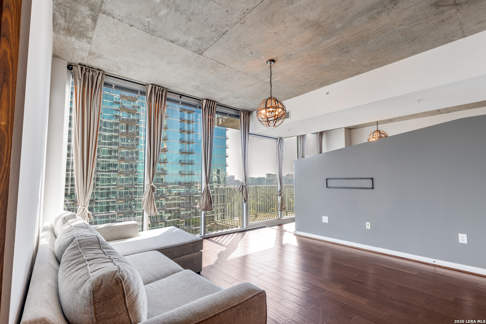 5925 Almeda Road, Unit 11710 Houston, TX 77004 - Photo 11 of 25 a living room with furniture and a chandelier