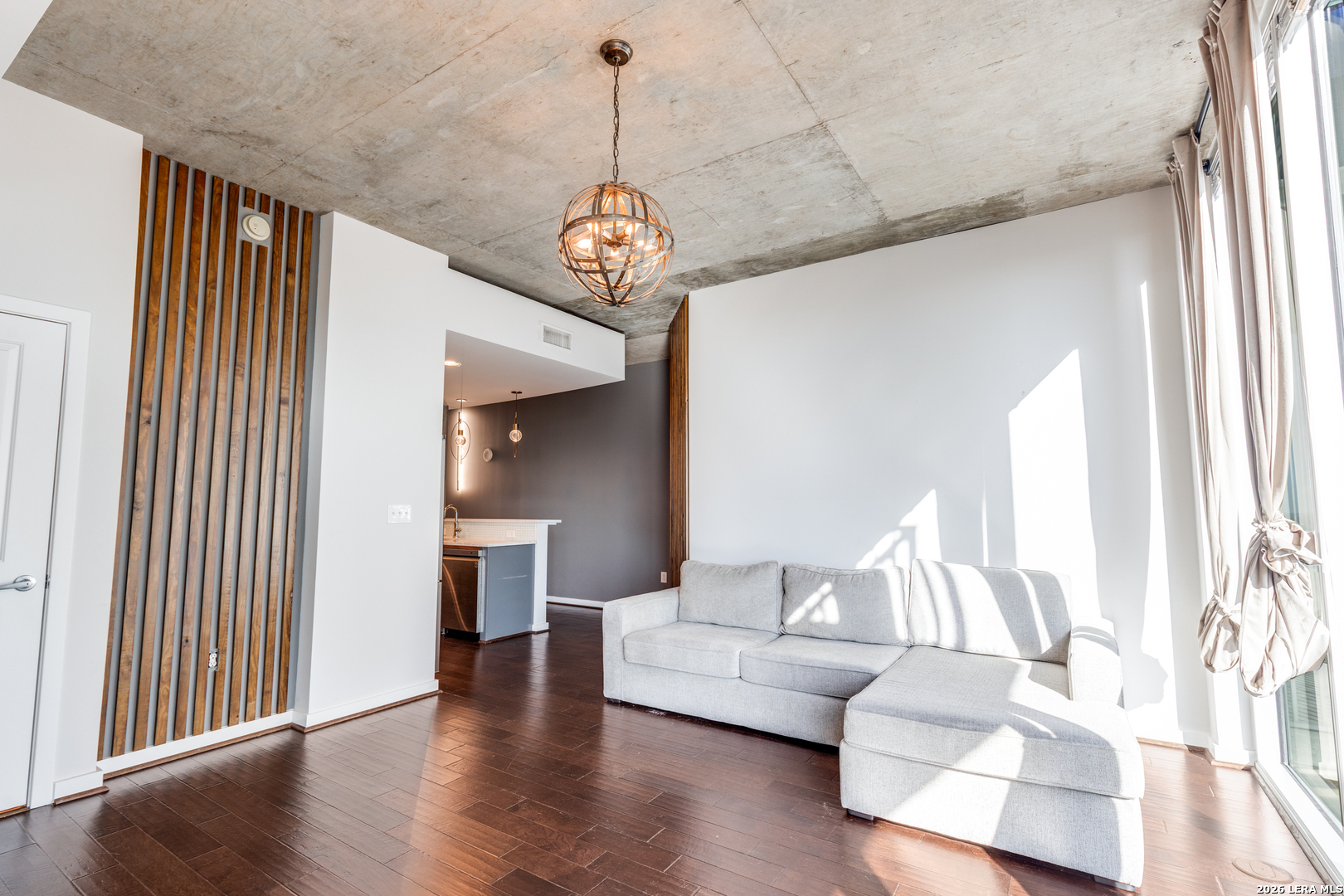 5925 Almeda Road, Unit 11710 Houston, TX 77004 - Photo 7 of 25 a view of a living room filled with furniture and wooden floor