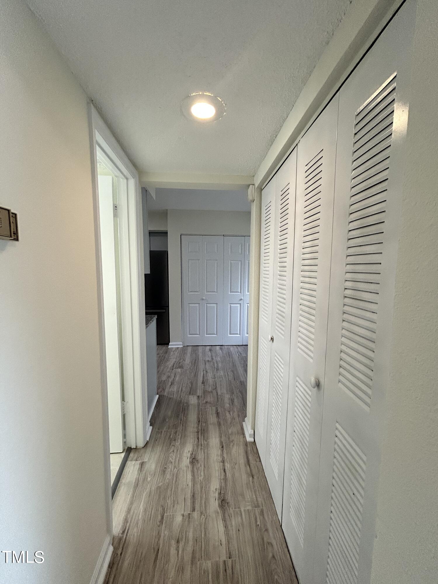 2426 Condor Court Raleigh, NC 27615 - Photo 10 of 28 a view of a room with wooden floor and a bathroom