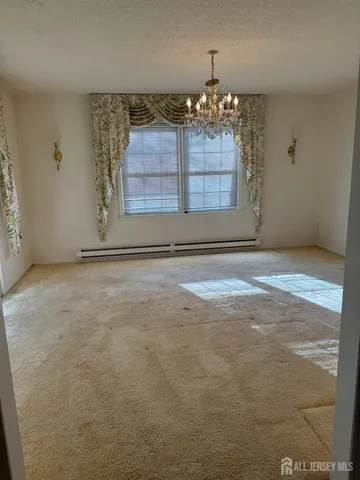 a view of an empty room with a fireplace