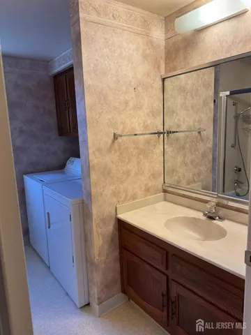 a bathroom with a sink and mirror