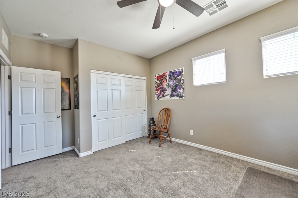 1054 Langston Ranch Avenue Henderson, NV 89002 - Photo 40 of 82 Bedroom 2 Very large Carpeted bedroom with a closet and ceiling fan