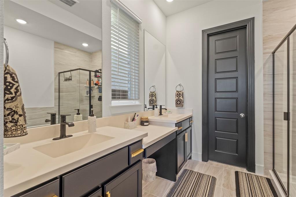 5009 Duck Cv Circle Royse City, TX 75189 - Photo 13 of 34 a bathroom with a sink and a mirror
