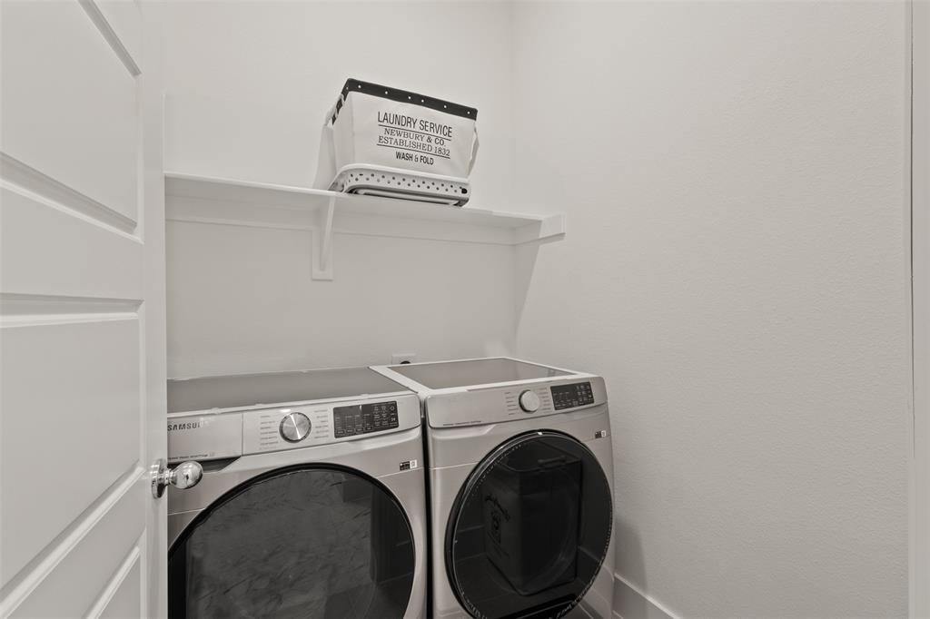 5009 Duck Cv Circle Royse City, TX 75189 - Photo 16 of 34 a utility room with dryer and washer