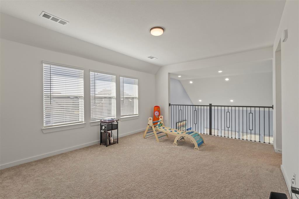 5009 Duck Cv Circle Royse City, TX 75189 - Photo 20 of 34 a living room with furniture and windows