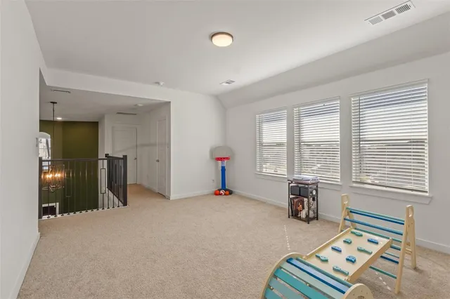a living room with furniture and windows