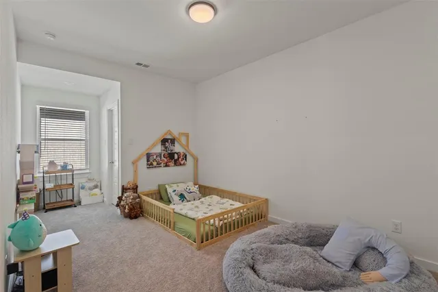 a bathroom with a sink a toilet and shower curtain
