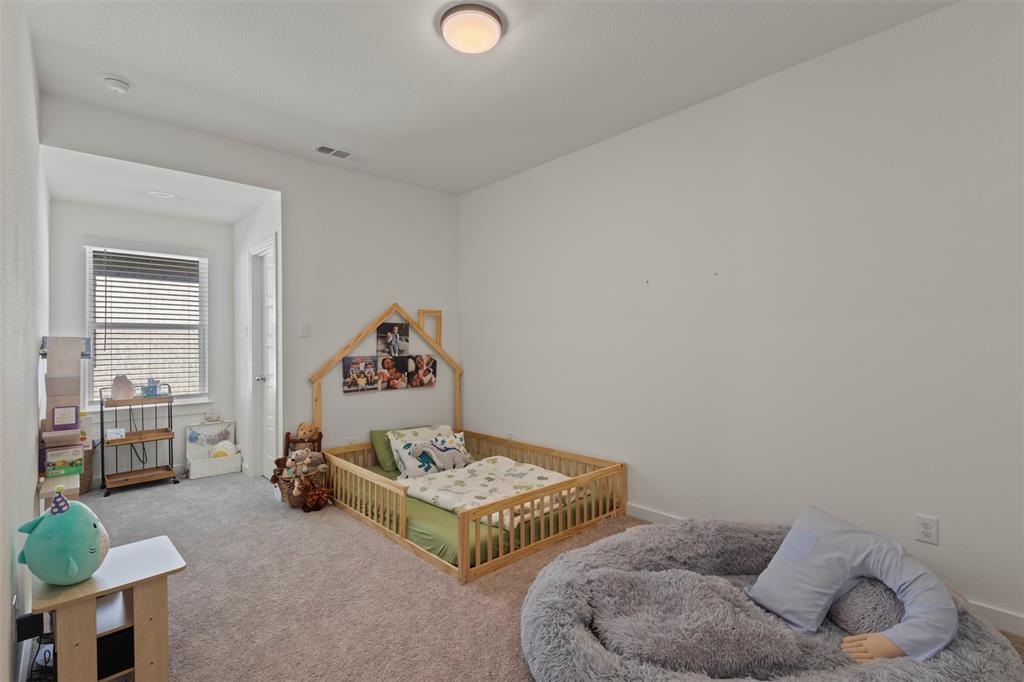 5009 Duck Cv Circle Royse City, TX 75189 - Photo 24 of 34 a bedroom with a bed and window