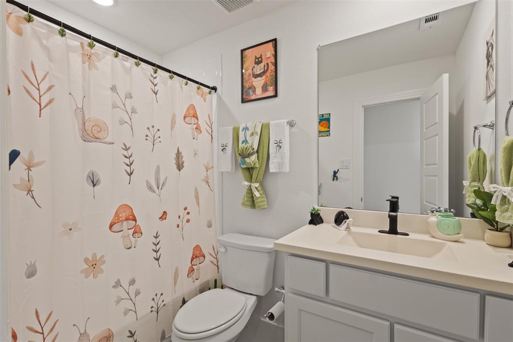 5009 Duck Cv Circle Royse City, TX 75189 - Photo 25 of 34 a bathroom with a sink and a mirror