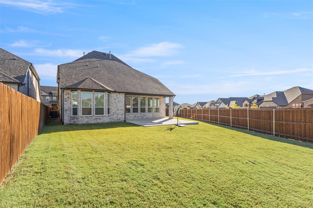 5009 Duck Cv Circle Royse City, TX 75189 - Photo 30 of 34 a view of a house with swimming pool and a yard
