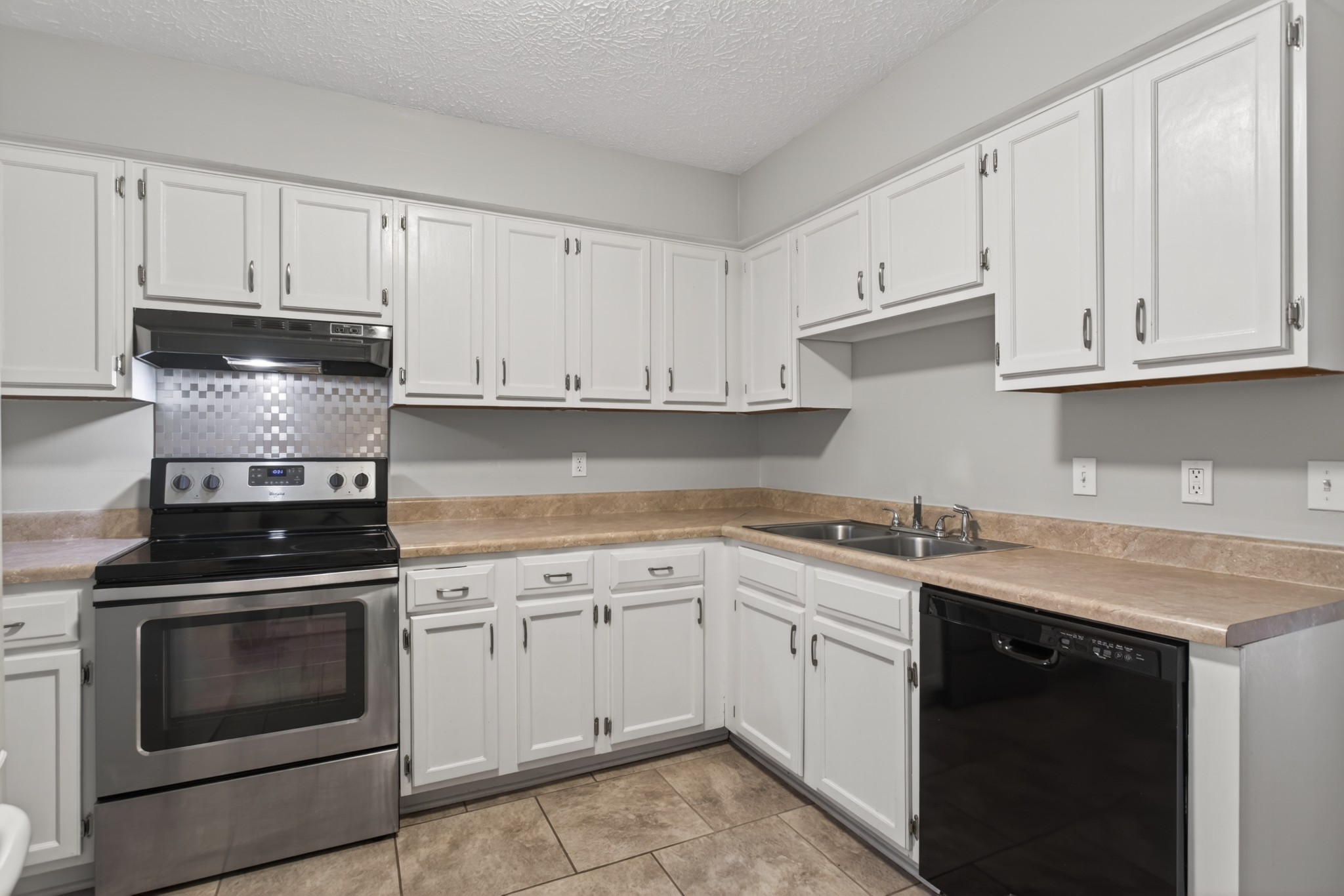 430 Walton Ferry Road, Unit 200 Hendersonville, TN 37075 - Photo 9 of 16 a kitchen with cabinets stainless steel appliances and a sink