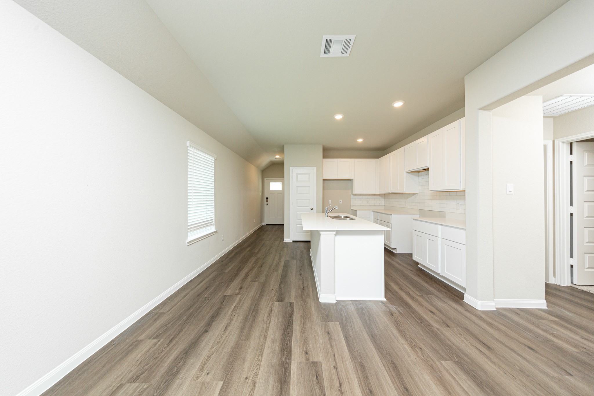 13654 Kit Run Splendora, TX 77372 - Photo 4 of 24 a kitchen with a white wooden cabinets and white appliances