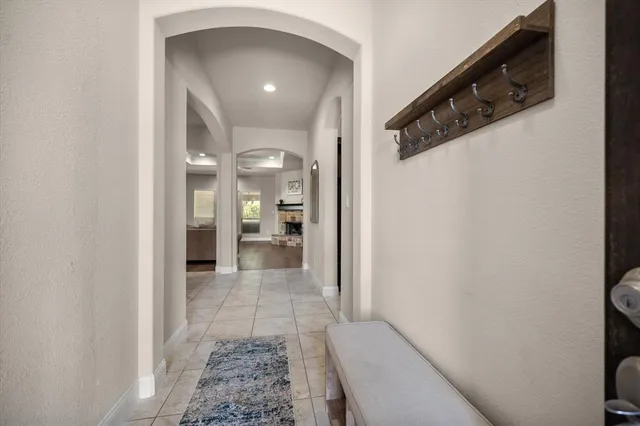 a view of a hallway with a living room