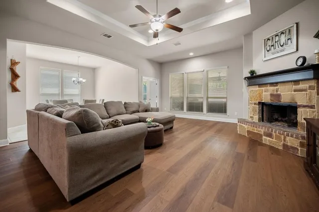 a living room with furniture and a fireplace