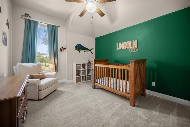 a bedroom with furniture and a window