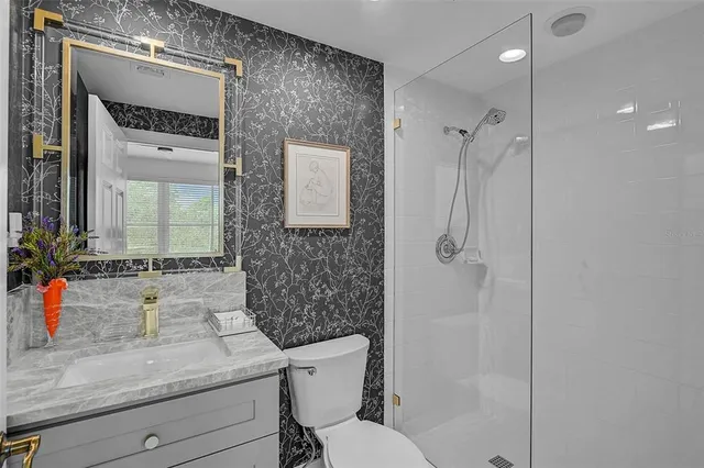 an aerial view of a house with outdoor space