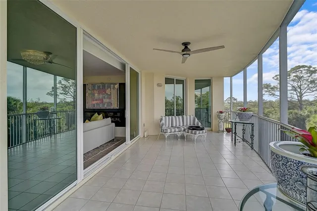 a view of a house with backyard sitting area and swimming pool