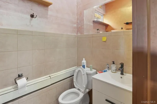a bathroom with a sink toilet and vanity