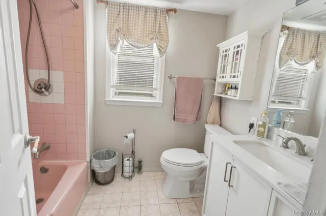 a bathroom with a sink toilet and tub