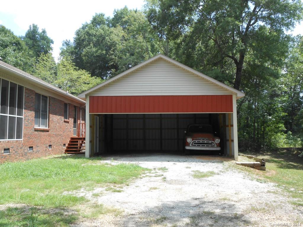 1347 Lee Ormand Road Lancaster, SC 29720 - Photo 2 of 18 a view of a house with a yard and garage