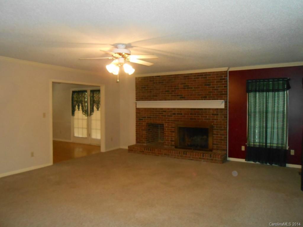 1347 Lee Ormand Road Lancaster, SC 29720 - Photo 6 of 18 a view of a livingroom with a fireplace and window
