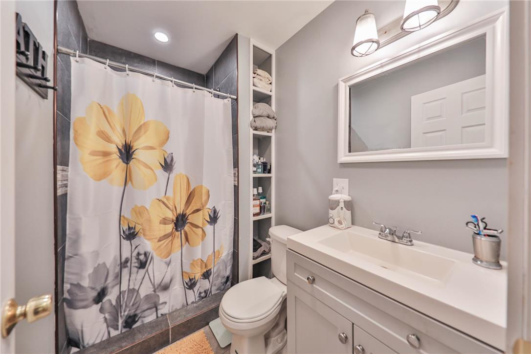 24 Turkey Ridge Road East Stroudsburg, PA 18302 - Photo 12 of 34 Clean lines and custom built-in shelving maximize the space in this modern bathroom.