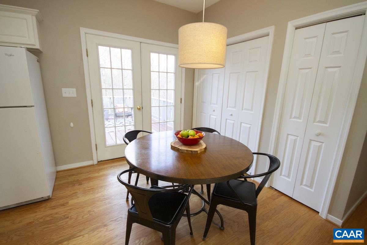 316 Starcrest Road Charlottesville, VA 22902 - Photo 9 of 33 a view of a dining room with furniture and wooden floor