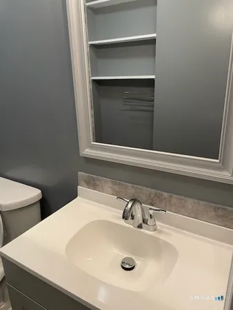 a bathroom with a sink and a toilet