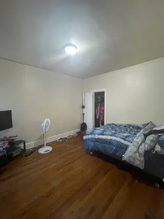 a bedroom with bed and window