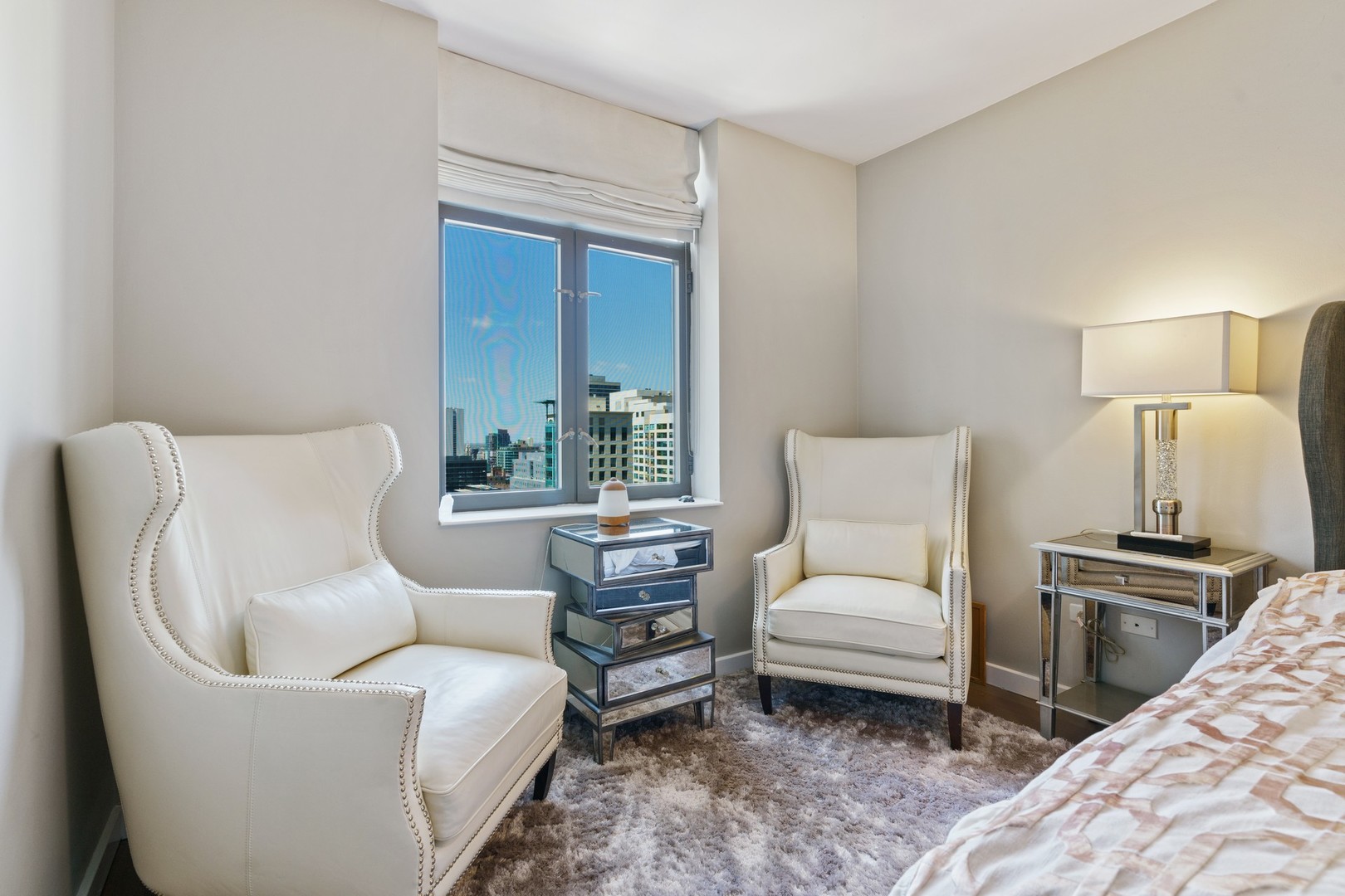 630 North State Street, Unit 2210 Chicago, IL 60654 - Photo 11 of 23 a living room with furniture and a lamp