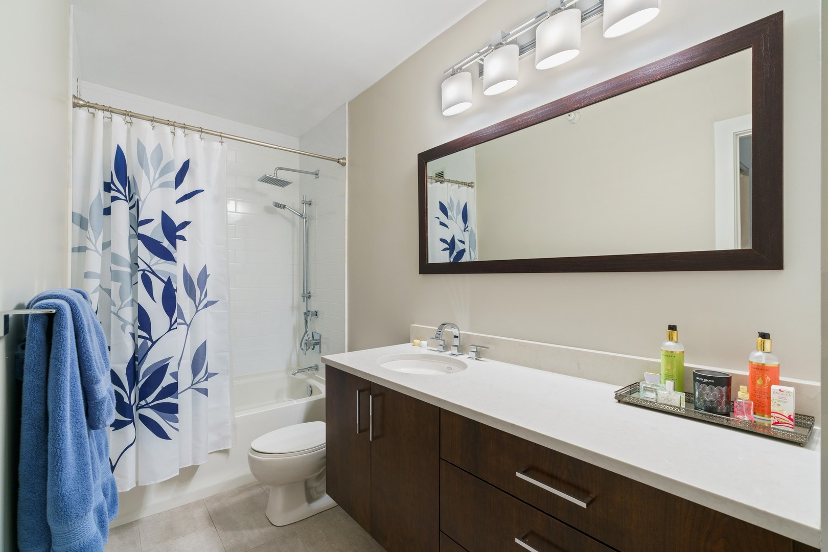630 North State Street, Unit 2210 Chicago, IL 60654 - Photo 12 of 23 a bathroom with a double vanity sink mirror and toilet