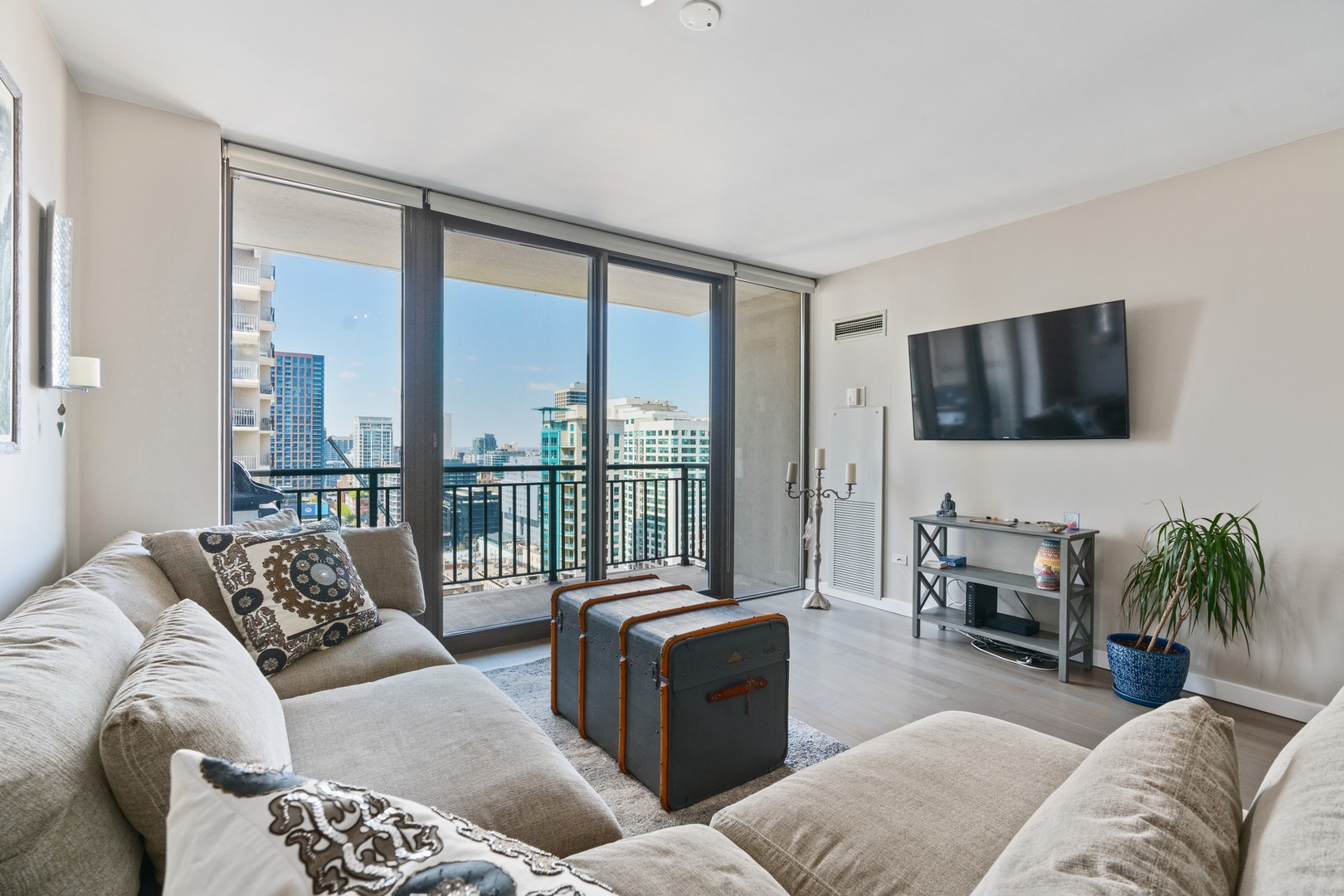630 North State Street, Unit 2210 Chicago, IL 60654 - Photo 3 of 23 a living room with furniture and a flat screen tv